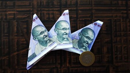indian currency isolated on brown background closeup image