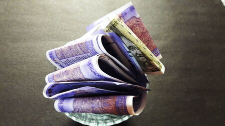 indian currency isolated on black background closeup image