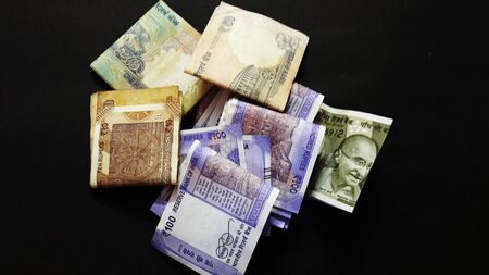 indian currency isolated on black background closeup imageの写真素材