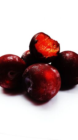 fresh healthy plum isolated on white background closeup