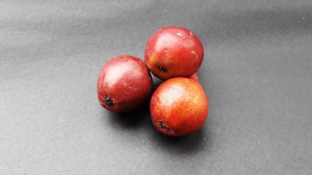 fresh healthy pear isolated on black background closeup