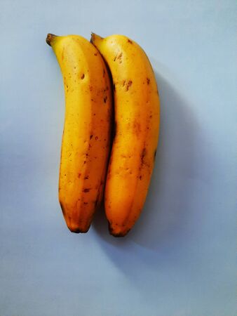 rip banana isolated on green backgroundの写真素材