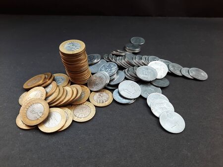 indian coins isolated on black background