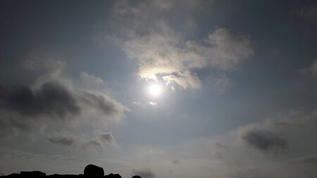 fluffy clouds in skyの写真素材