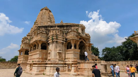 Unidentified people visit a temple in Khajuraho, India. It is one of the tallest buildings in India.