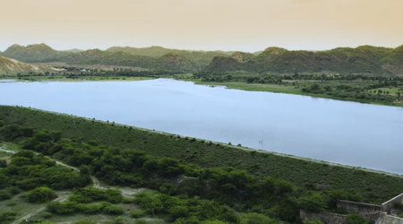 Landscape view of a lake in the middle of the green hills
