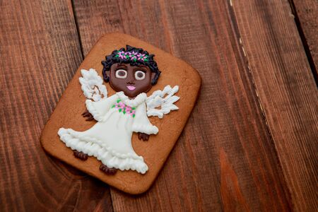 Christmas homemade gingerbread cookies on wooden backgroundの写真素材
