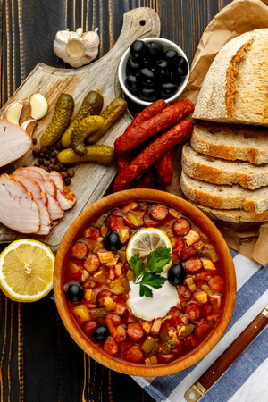 Solyanka - Russian traditional meat soup on wooden backgroundの写真素材