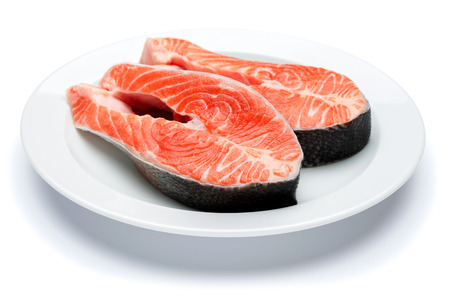 Fresh Raw Salmon Red Fish Steak on a White Backgroundの写真素材