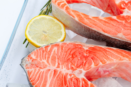 Fresh Raw Salmon Red Fish Steak isolated on iceの写真素材