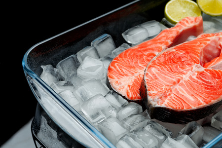 Fresh Raw Salmon Red Fish Steak isolated on iceの写真素材