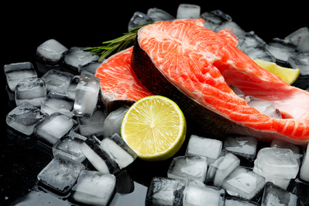 Fresh Raw Salmon Red Fish Steak isolated on iceの写真素材