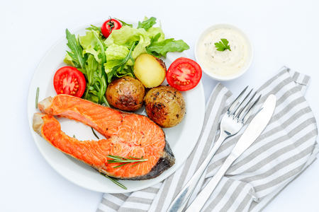 Crispy roasted salmon steak Isolated on white background.の写真素材