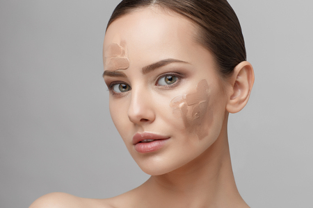Beautiful Face of Young Woman with Clean Fresh Skin close up isolated on white. Beauty Portrait. Beautiful Spa Woman Smiling. Perfect Fresh Skin. Pure Beauty Model. Youth and Skin Care Conceptの写真素材