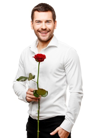 Young man carries flowers isolated on whiteの写真素材