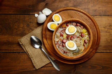 Traditional Zurek with sausage and egg, white borscht, polish homemade Easter soupの写真素材