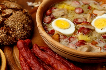 Traditional Zurek with sausage and egg, white borscht, polish homemade Easter soupの写真素材