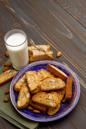 Italian cantuccini cookie with almond filling. Studio shot, isolated on wooden backgroundの写真素材