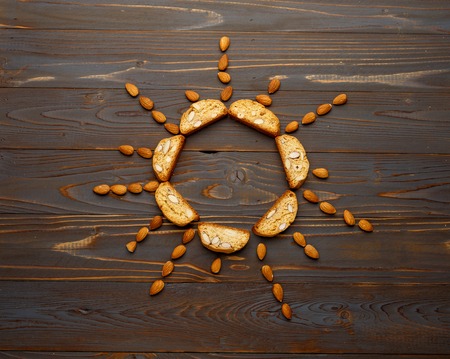 Italian cantuccini cookie with almond filling. Studio shot, isolated on wooden backgroundの写真素材