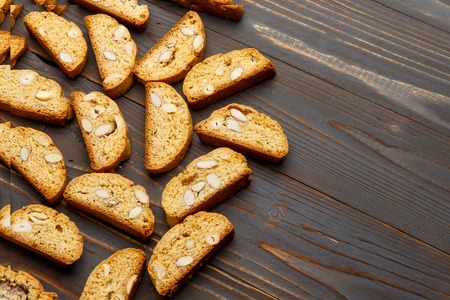 Italian cantuccini cookie with almond filling. Studio shot, isolated on wooden backgroundの写真素材