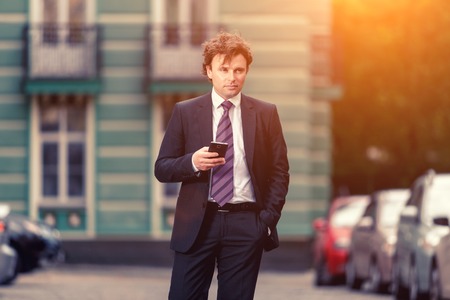 Handsome mature caucasian businessman outdoor wearing suitの写真素材