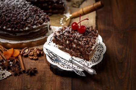 Homemade chocolate pie on vintage wooden background