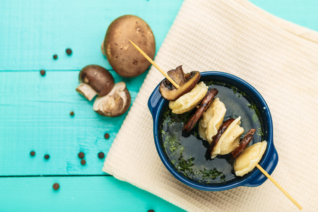 Meat Dumplings - russian boiled pelmeni in plate on wooden tableの写真素材