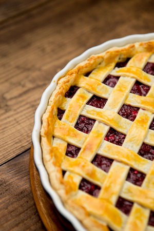 Homemade cherry pie on wooden table. Elevated viewの写真素材