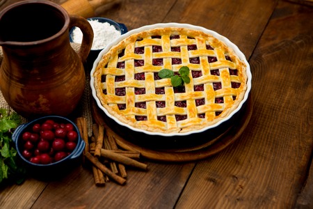 Homemade cherry pie on wooden table. Elevated viewの写真素材