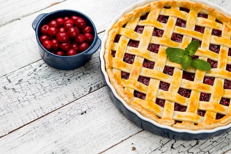 Homemade cherry pie on wooden table. Elevated viewの写真素材