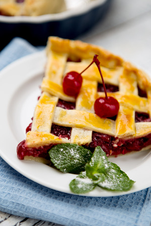 Homemade cherry pie on wooden table. Elevated viewの写真素材