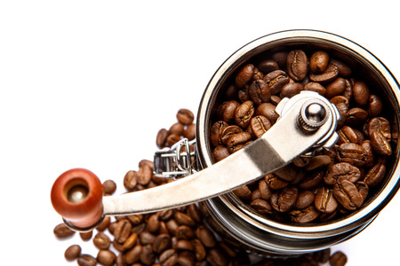 coffee mill and roasted beans isolated on white background cutoutの写真素材