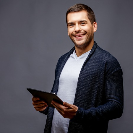 Cheerful young man in smart casual wearの写真素材