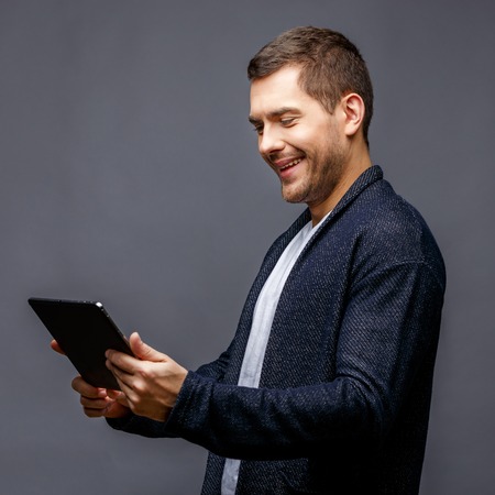 Cheerful young man in smart casual wearの写真素材