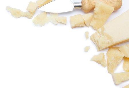pieces of Parmesan cheese and knife on white backgroundの写真素材