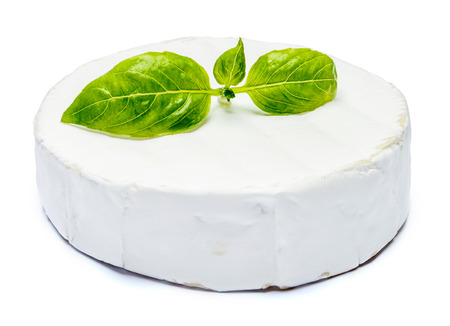 Round brie or camambert cheese on a white backgroundの写真素材