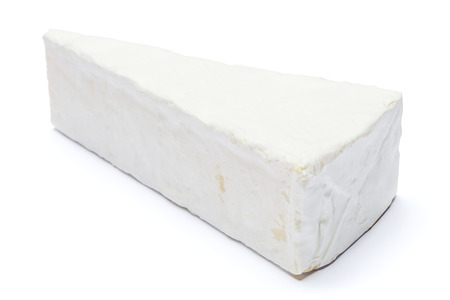 Piece of brie or camambert cheese on a white backgroundの写真素材
