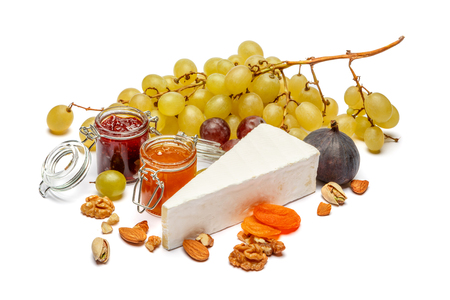 Piece of brie or camambert cheese on a white backgroundの写真素材