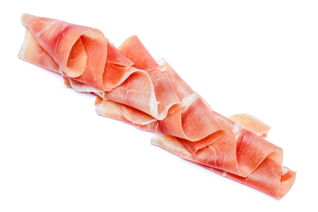 Italian prosciutto crudo or spanish jamon. Raw ham on white background.の写真素材