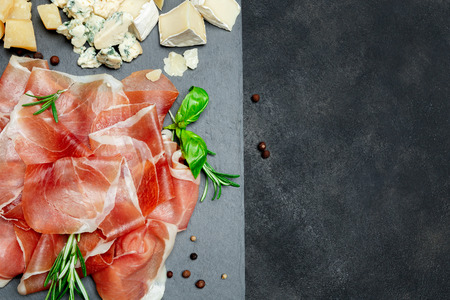 Italian prosciutto crudo or spanish jamon and cheeseの写真素材