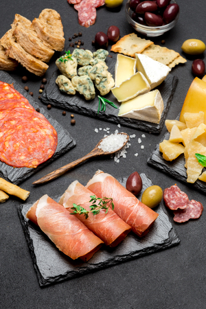 various type of italian meal or snack - cheese, sausage, olives and parmaの写真素材