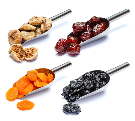 Set of scoops full of dried fruits isolated on whiteの写真素材