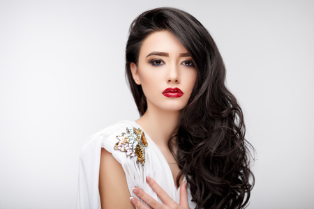 Brunette asian girl with long curly hairの写真素材