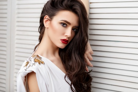 Brunette asian girl with long curly hairの写真素材