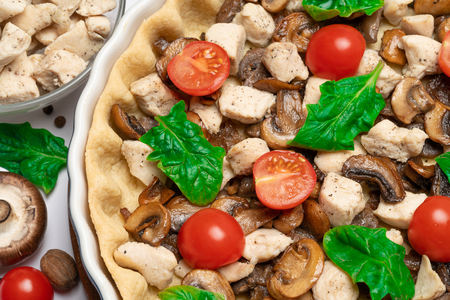 shortbread dough for baking quiche tart and filling in baking formの写真素材