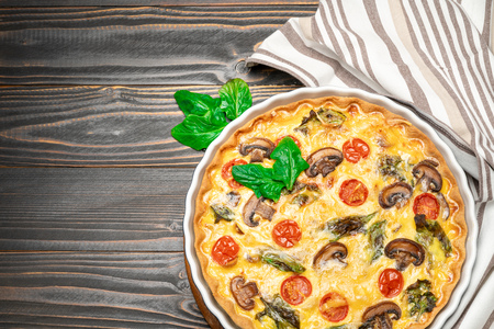 Baked homemade quiche pie in ceramic baking formの写真素材