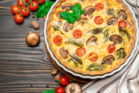 Baked homemade quiche pie in ceramic baking formの写真素材