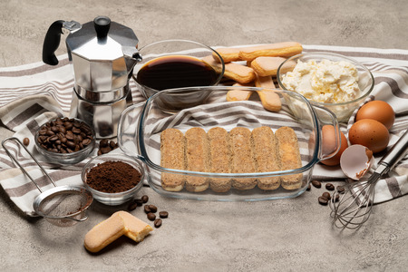 Ingredients for traditional tiramisu cake on concrete backgroundの写真素材