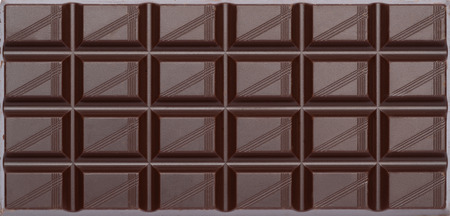 dark organic natural chocolate bar close-up top view