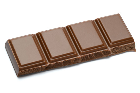 Milk organic chocolate pieces isolated on white background